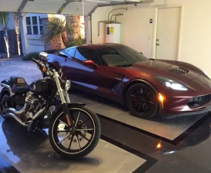 car and motorcycle parked atop their epoxy garage floor